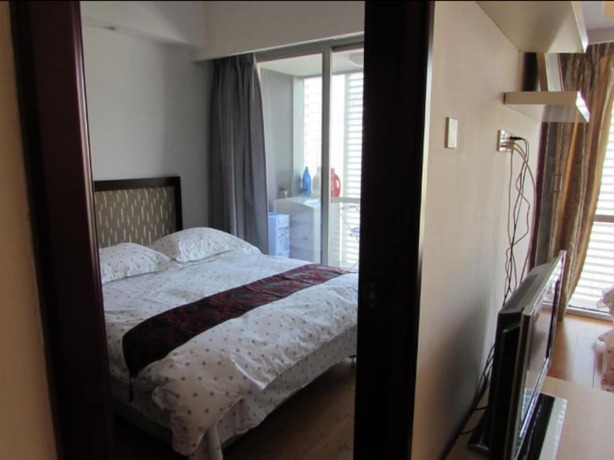 Imagen de la habitación del Hotel Guangzhou Damei Apartment. Foto 33