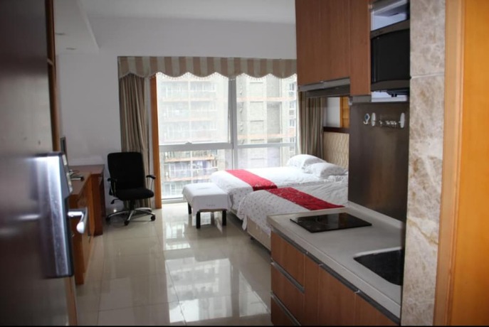 Imagen de la habitación del Hotel Guangzhou Damei Apartment. Foto 35