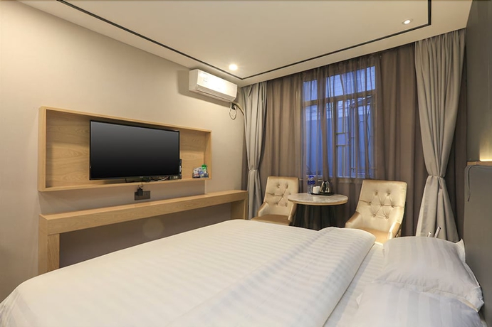 Imagen de la habitación del Hotel Guangzhou Freedom. Foto 9