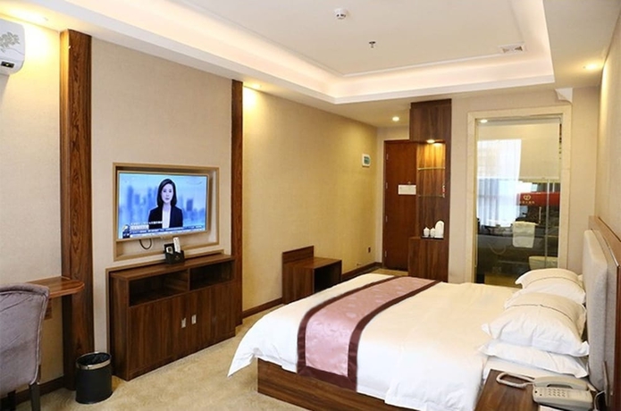 Imagen de la habitación del Hotel Guangzhou Helong. Foto 3