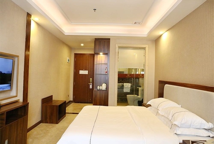 Imagen de la habitación del Hotel Guangzhou Helong. Foto 11