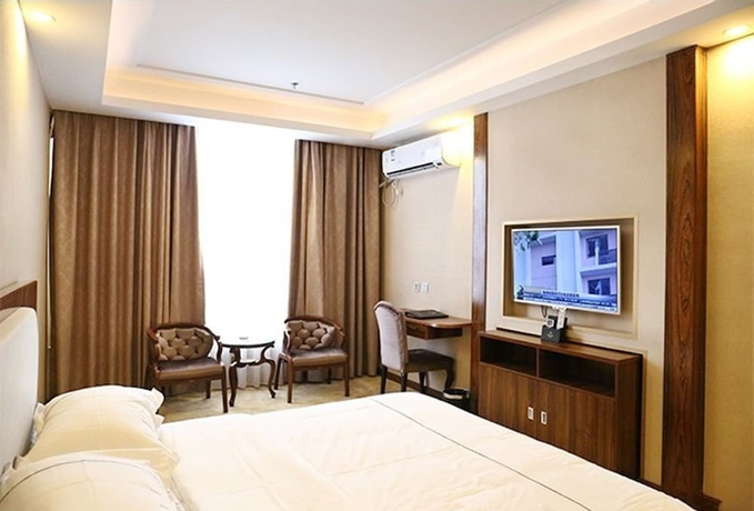 Imagen de la habitación del Hotel Guangzhou Helong. Foto 13