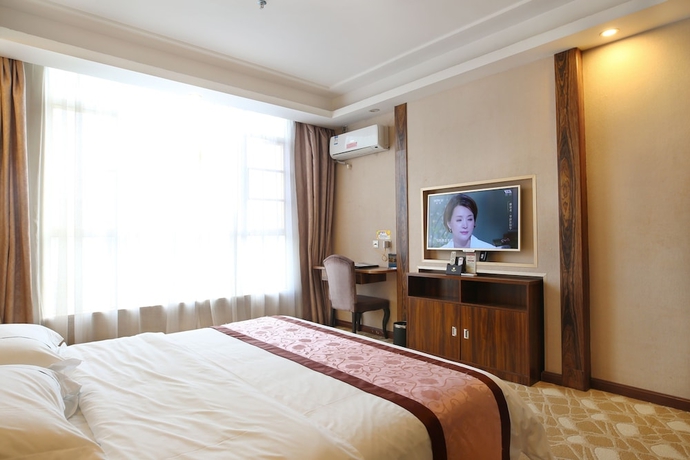 Imagen de la habitación del Hotel Guangzhou Helong. Foto 14