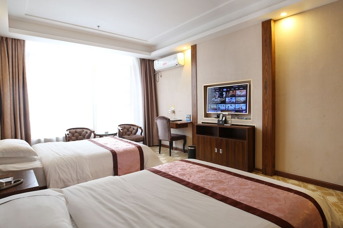 Imagen de la habitación del Hotel Guangzhou Helong. Foto 18