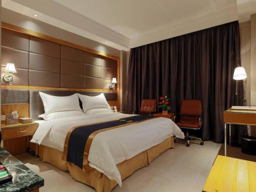 Imagen de la habitación del Hotel Guangzhou Heng He. Foto 2