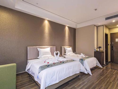 Imagen de la habitación del Hotel Guangzhou Kardon Gorgeous. Foto 6