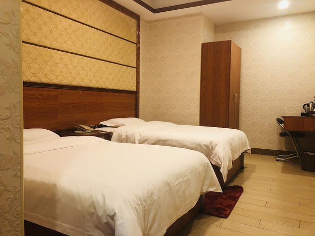Imagen de la habitación del Hotel Guangzhou Mei Ling. Foto 17
