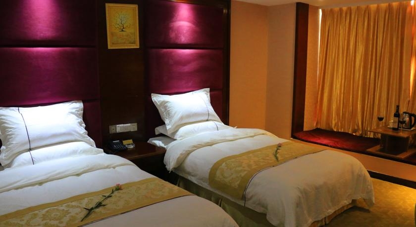 Imagen de la habitación del Hotel Guangzhou Meigang. Foto 2