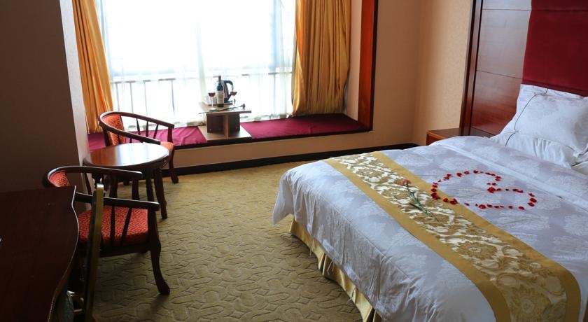 Imagen de la habitación del Hotel Guangzhou Meigang. Foto 3