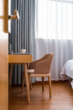 Imagen de la habitación del Hotel Guangzhou Mustin. Foto 7