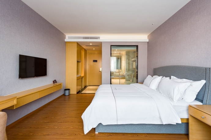 Imagen de la habitación del Hotel Guangzhou Mustin. Foto 8