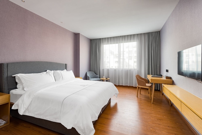 Imagen de la habitación del Hotel Guangzhou Mustin. Foto 9