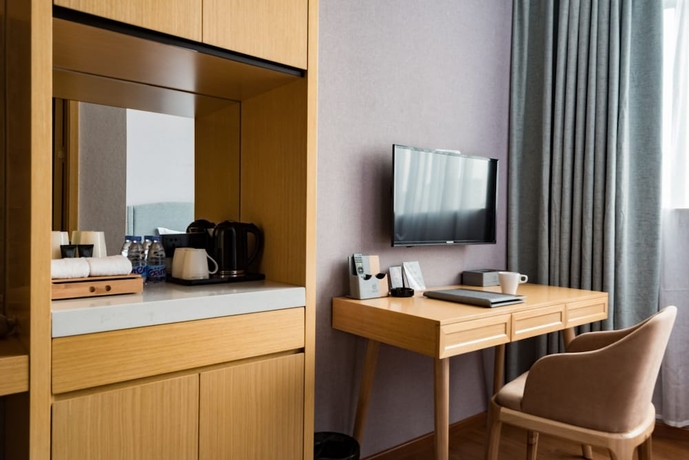 Imagen de la habitación del Hotel Guangzhou Mustin. Foto 11