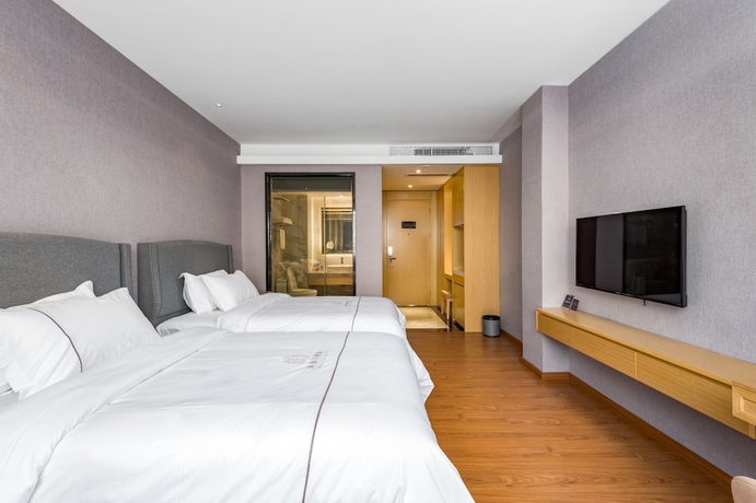 Imagen de la habitación del Hotel Guangzhou Mustin. Foto 12