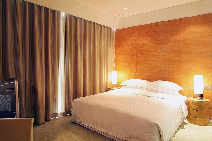 Imagen de la habitación del Hotel Guangzhou Nansha Pearl River Delta World Trade Center Tower. Foto 8
