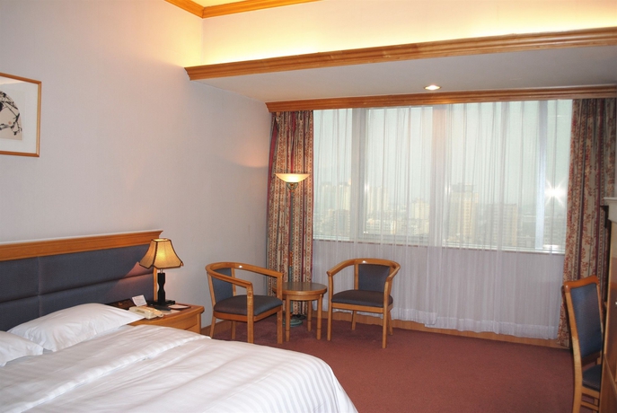 Imagen de la habitación del Hotel Guangzhou New Century. Foto 8