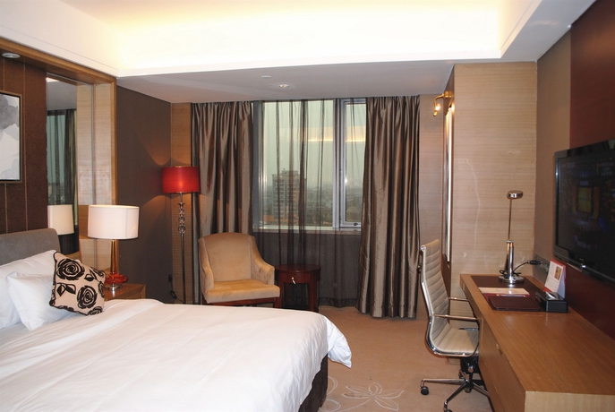 Imagen de la habitación del Hotel Guangzhou New Century. Foto 9