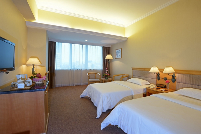 Imagen de la habitación del Hotel Guangzhou New Century. Foto 11