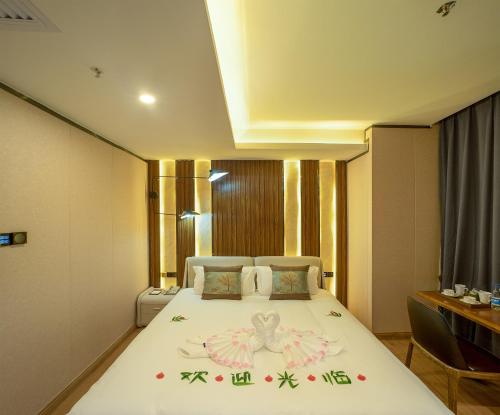 Imagen de la habitación del Hotel Guangzhou Nuomo International. Foto 7