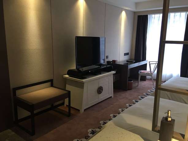 Imagen de la habitación del Hotel Guangzhou Paco - Dongpu Teemall. Foto 5