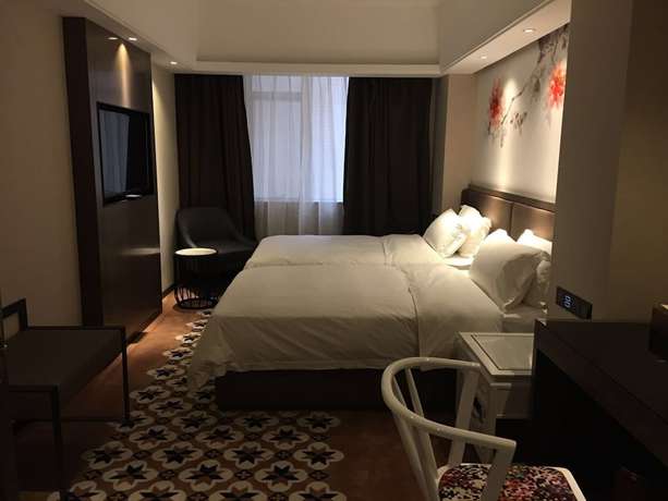 Imagen de la habitación del Hotel Guangzhou Paco - Dongpu Teemall. Foto 7