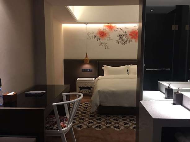 Imagen de la habitación del Hotel Guangzhou Paco - Dongpu Teemall. Foto 16