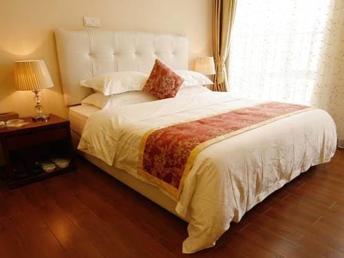 Imagen de la habitación del Hotel Guangzhou Pengman Apartment Huanshidong. Foto 7