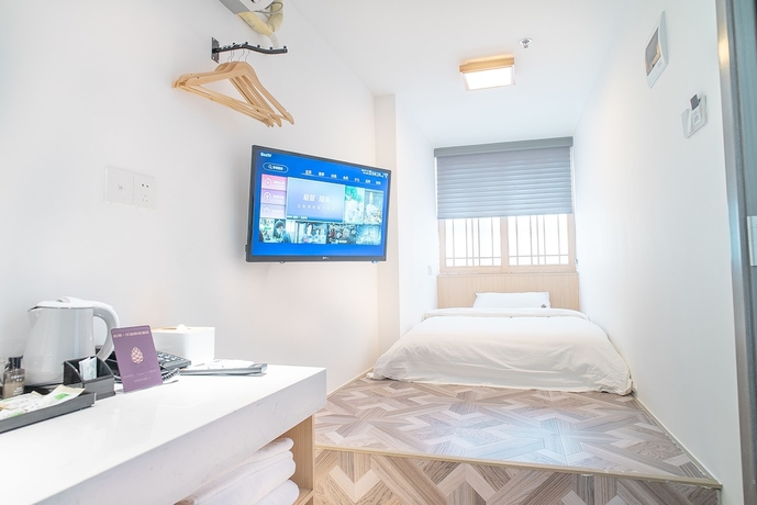 Imagen de la habitación del Hotel Guangzhou Pinecone and Huayi Select. Foto 2