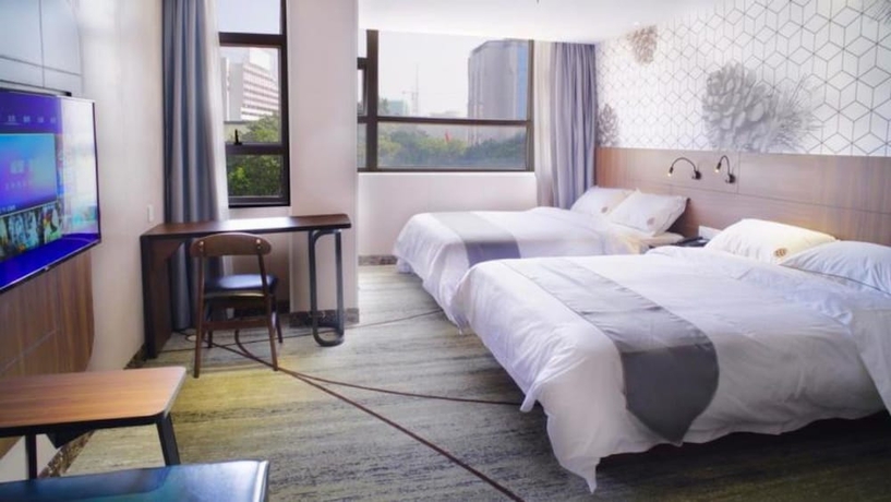 Imagen de la habitación del Hotel Guangzhou Pinecone and Huayi Select. Foto 4