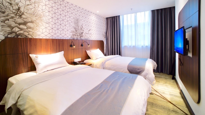 Imagen de la habitación del Hotel Guangzhou Pinecone and Huayi Select. Foto 6