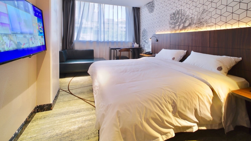 Imagen de la habitación del Hotel Guangzhou Pinecone and Huayi Select. Foto 8