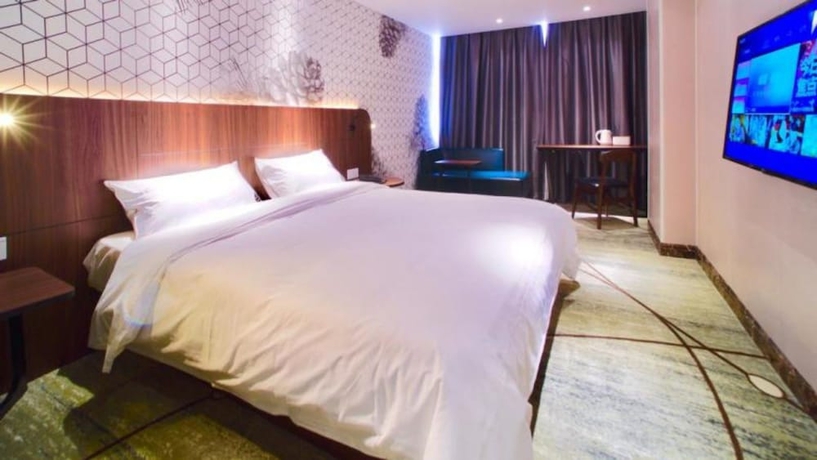 Imagen de la habitación del Hotel Guangzhou Pinecone and Huayi Select. Foto 9