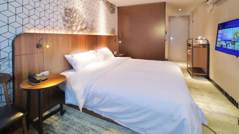 Imagen de la habitación del Hotel Guangzhou Pinecone and Huayi Select. Foto 11