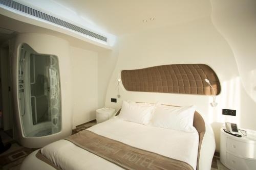 Imagen de la habitación del Hotel Guangzhou Planet. Foto 11