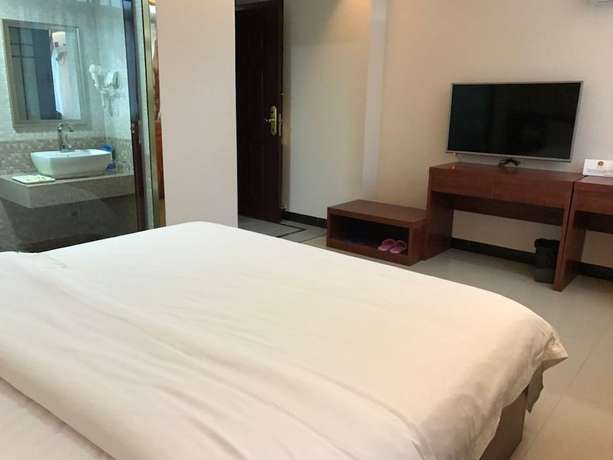Imagen de la habitación del Hotel Guangzhou Rongting Business. Foto 4