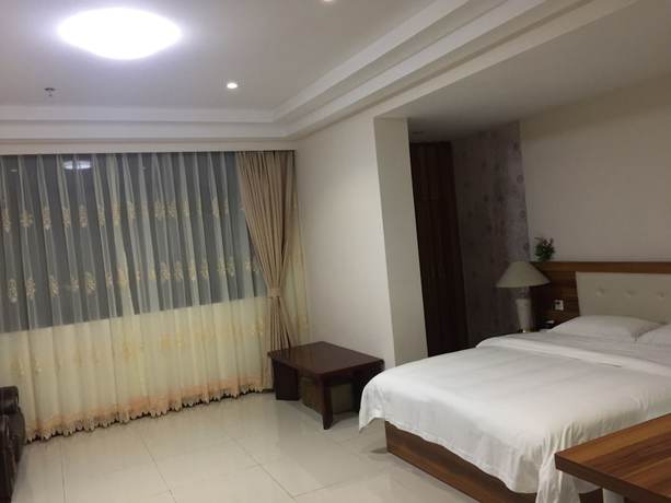 Imagen de la habitación del Hotel Guangzhou Rongting Business. Foto 8