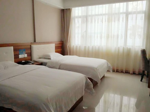 Imagen de la habitación del Hotel Guangzhou Rongting Business. Foto 10
