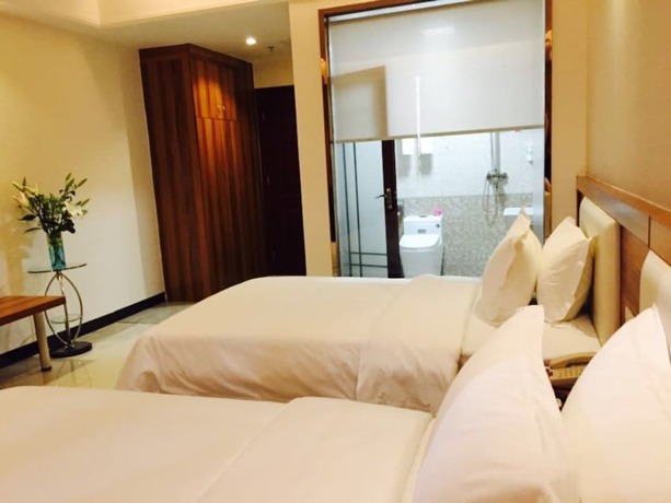 Imagen de la habitación del Hotel Guangzhou Rongting Business. Foto 12