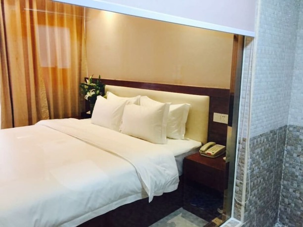 Imagen de la habitación del Hotel Guangzhou Rongting Business. Foto 15