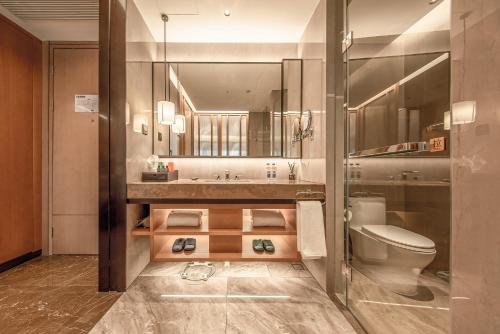 Imagen de la habitación del Hotel Guangzhou Vlamhoo. Foto 18