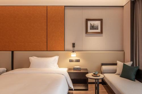 Imagen de la habitación del Hotel Guangzhou Vlamhoo. Foto 19