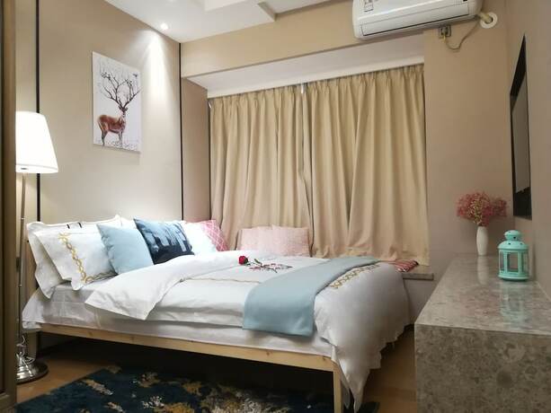 Imagen de la habitación del Hotel Guangzhou Xiwuju Service Apartment. Foto 12