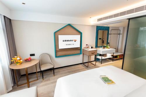 Imagen de la habitación del Hotel Guangzhou Yilin. Foto 19