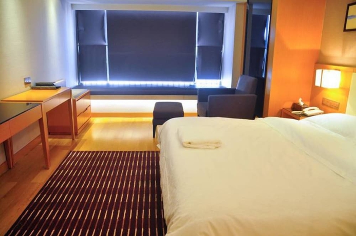 Imagen de la habitación del Hotel Guangzhou Yiyuan Apartment. Foto 2
