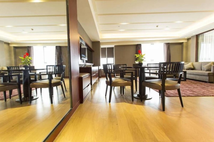 Imagen de la habitación del Hotel Guangzhou Yiyuan Apartment. Foto 4