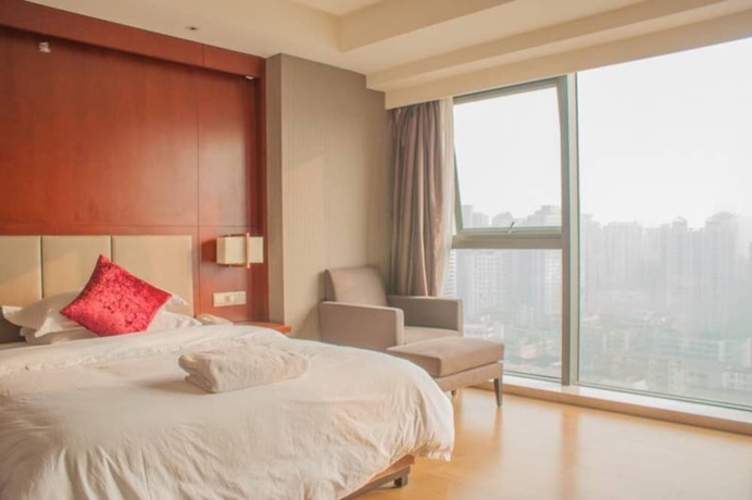Imagen de la habitación del Hotel Guangzhou Yiyuan Apartment. Foto 5