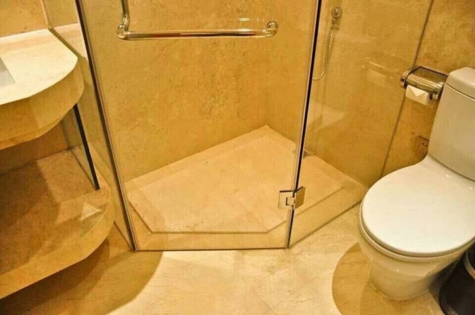 Imagen de la habitación del Hotel Guangzhou Yiyuan Apartment. Foto 7