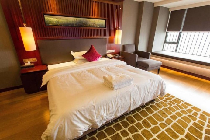 Imagen de la habitación del Hotel Guangzhou Yiyuan Apartment. Foto 8