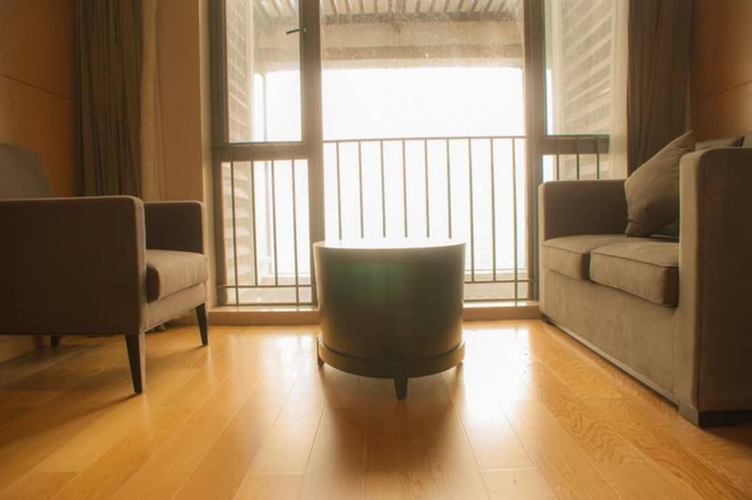 Imagen de la habitación del Hotel Guangzhou Yiyuan Apartment. Foto 10