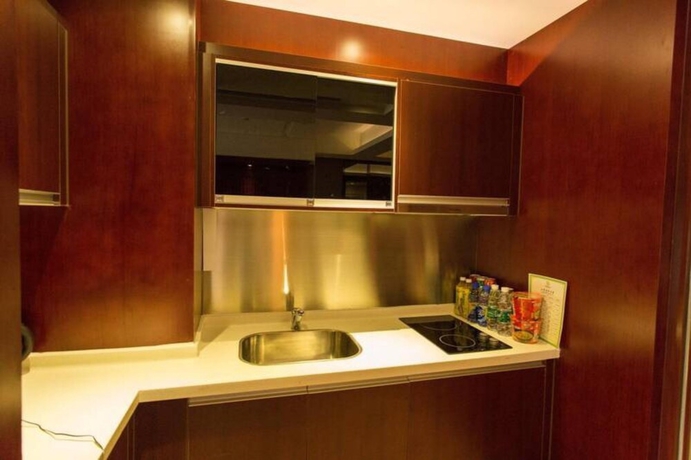 Imagen de la habitación del Hotel Guangzhou Yiyuan Apartment. Foto 11